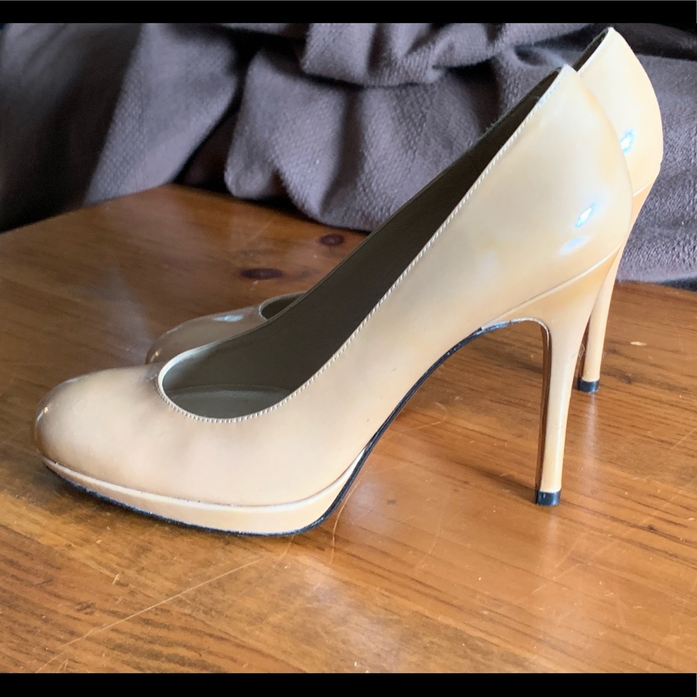 Stuart Weitzman nude patent platform pump.